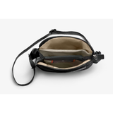 Bellroy City Pouch crossbody bag in black, featuring multiple compartments and adjustable strap for daily organization.