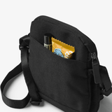 Black Bellroy City Pouch crossbody bag with multiple compartments and adjustable strap, designed for daily organization.