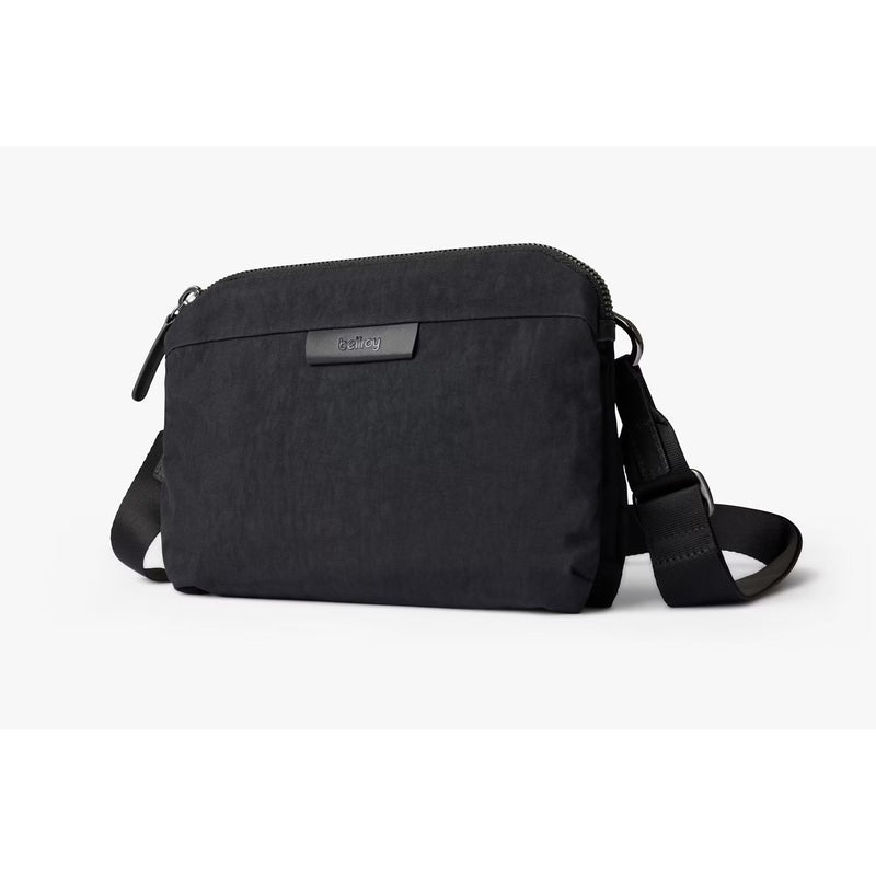 Bellroy Tokyo Side Bag in raven, a stylish crossbody bag with sleek design and adjustable strap for everyday use.