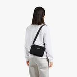 Bellroy Tokyo Side Bag in Raven, a sleek crossbody bag with multiple compartments and adjustable strap for everyday use.