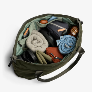 Bellroy Classic Getaway Bag shown as a stylish black duffel bag with handles and a shoulder strap, designed for travel and storage.