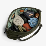 Bellroy Classic Getaway Bag shown as a stylish black duffel bag with handles and a shoulder strap, designed for travel and storage.