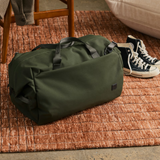 Bellroy Classic Duffel 35L in black, showing its spacious main compartment and durable fabric for travel use.