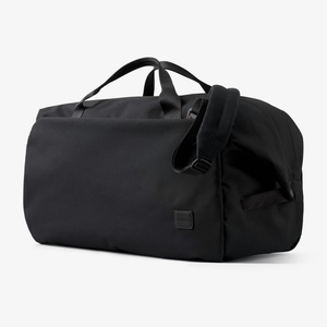 Bellroy Classic Duffel 45L in durable fabric, shown with adjustable shoulder strap and spacious main compartment for travel.