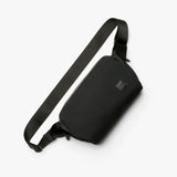 Bellroy Classic Sling 5L bag with adjustable strap, front zip pocket, and sleek black design for versatile everyday use.