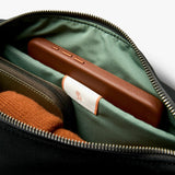 Bellroy Classic Sling 5L in black, featuring a compact design with adjustable strap and multiple compartments for everyday essentials.