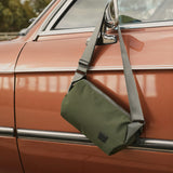 Bellroy Classic Sling 5L bag showing front view with zipper compartments and adjustable strap, made of durable material.