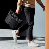 Bellroy Tokyo Messenger Bag 16-inch in raven color, showing its sleek exterior with adjustable shoulder strap and minimalist design.