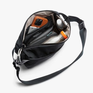 Bellroy Lite Sling bag showing its compact, sleek design with adjustable strap and front zipper pocket for everyday carry.