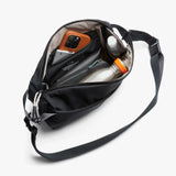 Bellroy Lite Sling bag showing its compact, sleek design with adjustable strap and front zipper pocket for everyday carry.