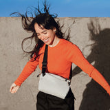 Bellroy Lite Sling Mini in black, compact crossbody sling bag with adjustable strap and multiple compartments for essentials.