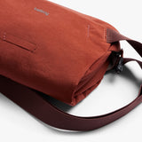 Bellroy Lite Sling Mini in black, compact sling bag with adjustable strap and multiple compartments for everyday essentials.