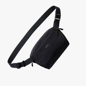 Bellroy Lite Sling Mini in black showing compact sling bag with adjustable strap and sleek design.