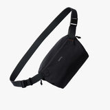 Bellroy Lite Sling Mini in black showing compact sling bag with adjustable strap and sleek design.