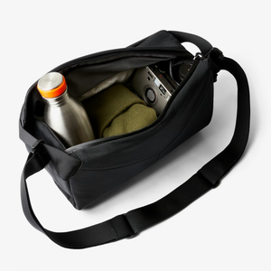 Bellroy Venture Sling 9L in black with adjustable strap and multiple compartments for versatile everyday carrying.