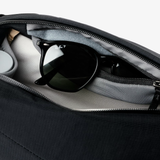 Bellroy Venture Sling 9L backpack with adjustable strap, front zip pocket, and durable black fabric for everyday use.