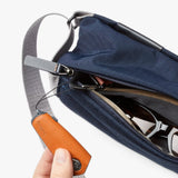 Bellroy Sling Mini in black, compact crossbody bag with adjustable strap and multiple compartments, designed for everyday organization.
