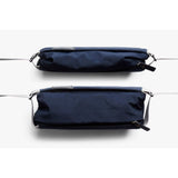 Bellroy Sling Mini compact sling bag with adjustable strap, featuring multiple compartments and sleek design in black fabric.