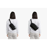Bellroy Sling Mini in black fabric, compact crossbody sling bag with adjustable strap and multiple compartments.