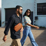 Bellroy Sling Mini crossbody bag showing sleek design with adjustable strap and compact size for everyday carry.
