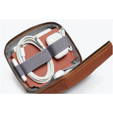Black Bellroy Tech Kit Compact with multiple compartments and zippers for organizing cables, chargers, and tech accessories.