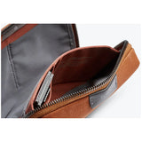 Black Bellroy Tech Kit Compact showing multiple compartments and zipper closure, designed for organizing tech accessories.