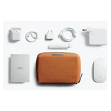 Bellroy Tech Kit Compact in black, showing a sleek, organized tech accessories storage pouch with multiple compartments.