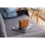 Bellroy Tech Kit Compact in black showing organized interior with multiple compartments for cables and accessories.