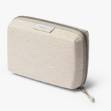 Bellroy Tech Kit Compact in black, a slim organized tech accessories case with multiple compartments for cables and gadgets.