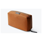 Bellroy Tech Kit showing organized interior with compartments for cables, chargers, and accessories, made of durable material.