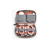 Bellroy Tech Kit with organized compartments for cables, accessories, and gadgets, made of durable fabric.