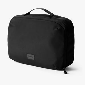 Bellroy Hanging Toiletry Kit Plus in stone, a compact toiletry bag with hanging design and multiple compartments for travel essentials.