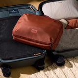 Bellroy Hanging Toiletry Kit Plus in stone, compact travel toiletry bag with hanging design and multiple compartments.