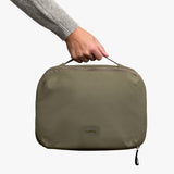 Bellroy Hanging Toiletry Kit Plus in stone, a compact travel toiletry bag with hanging hook and multiple compartments.