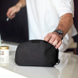 Bellroy toiletry kit in clay color, compact travel organizer with multiple compartments for toiletries and grooming essentials.