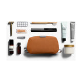 Bellroy toiletry kit in clay color, compact travel bag with multiple compartments for toiletries and grooming essentials.