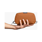 Bellroy toiletry kit in clay color, compact travel organizer with multiple compartments and durable fabric for toiletries.