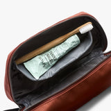 Bellroy Toiletry Kit Plus in clay color, compact travel toiletry bag with multiple compartments for organizing personal essentials.