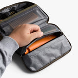 Bellroy hanging toiletry kit in Sea Kelp color, compact travel bag with multiple compartments and a hanging hook for easy access.