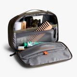Bellroy hanging toiletry kit in Sea Kelp color, with compartments and zipper closure for organized travel essentials.