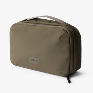 Bellroy Hanging Toiletry Kit in Sea Kelp, compact travel organizer with multiple compartments and a hanging hook for convenience.