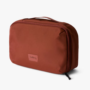 Bellroy Hanging Toiletry Kit in Sea Kelp color, shown open with organized compartments for travel toiletries.