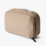 Bellroy Hanging Toiletry Kit in Sea Kelp, showing compact design with multiple compartments for travel toiletries.