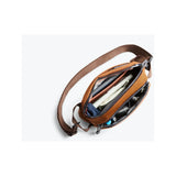 Bellroy Venture Ready Sling 2.5L waist pack, compact and functional with adjustable strap, black fabric, and zipper compartments.