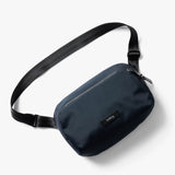 Black Bellroy Transit Sling 5L waist pack shown with adjustable strap and compact design for everyday carry and convenience.