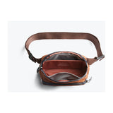 Bellroy Venture Hip Pack 1.5L waist pack with multiple compartments, black nylon material, and adjustable strap.