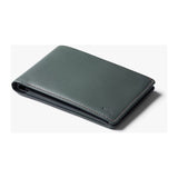 Bellroy travel wallet in caramel leather showing multiple card slots and cash compartment on a neutral background.