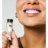 Bite Floss, dental floss product with a sleek design, showing the floss string and packaging in a clean, close-up shot.
