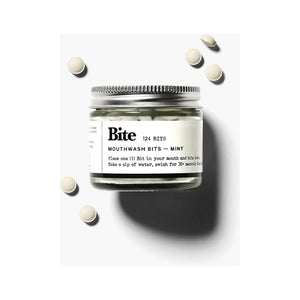Bite Mint Mouthwash Bits in a container, showing small, round mint-flavored mouthwash tablets designed for fresh breath.