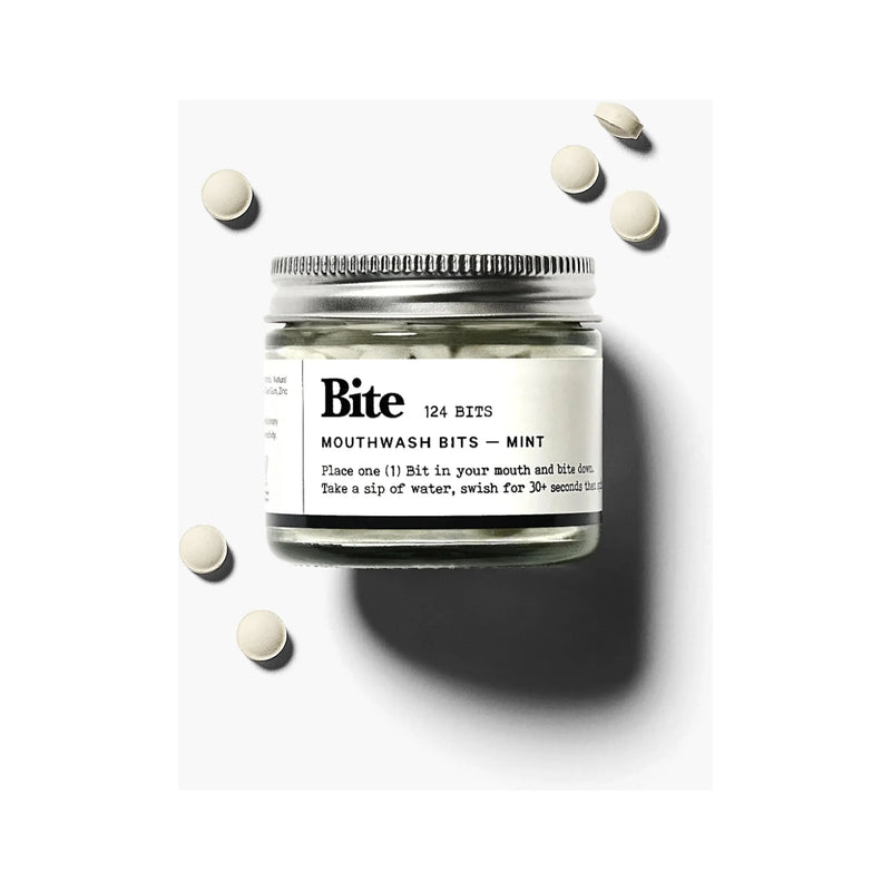 Bite Mint Mouthwash Bits in a container, showing small, round mint-flavored mouthwash tablets designed for fresh breath.